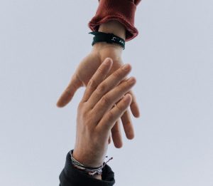 view of two persons hands