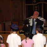Reverend Marciano blowing shofar